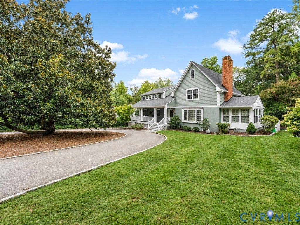 600 Baldwin Road, Henrico, VA 23229 Expansive front lawn with mature landscaping, a paved driveway, and a covered porch