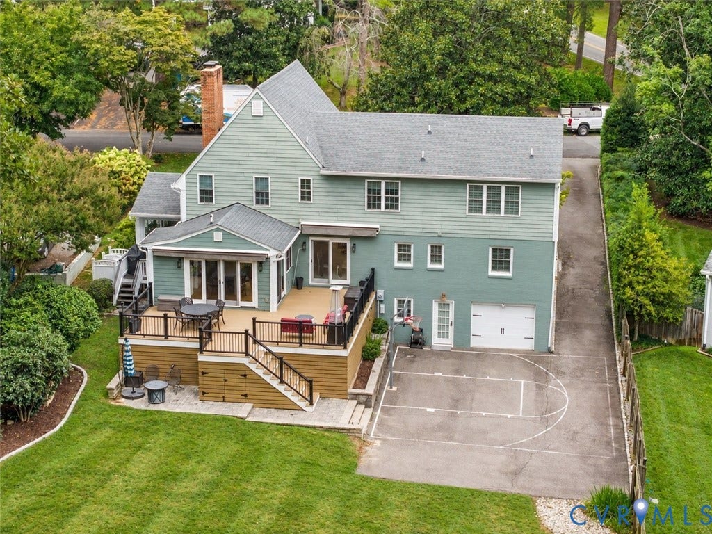 600 Baldwin Road, Henrico, VA 23229 Multi-level rear deck with dark railings, direct access to a bonus room, and a paved sport court