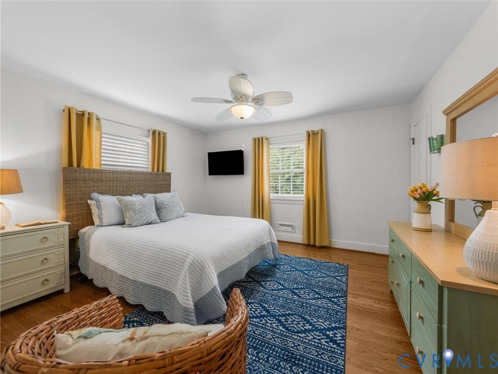 600 Baldwin Road, Henrico, VA 23229 Wood-finish flooring, ceiling fan with integrated lighting, and multiple windows with horizontal blinds