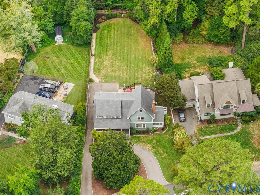 600 Baldwin Road, Henrico, VA 23229 Expansive residential property featuring multiple structures, mature trees, manicured lawns, and paved driveways