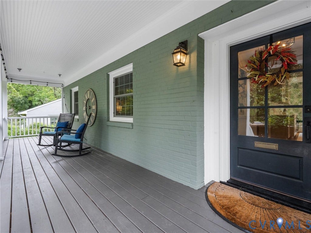 600 Baldwin Road, Henrico, VA 23229 Covered porch with painted wood flooring, brick exterior, beadboard ceiling, and a glass-paneled entry door