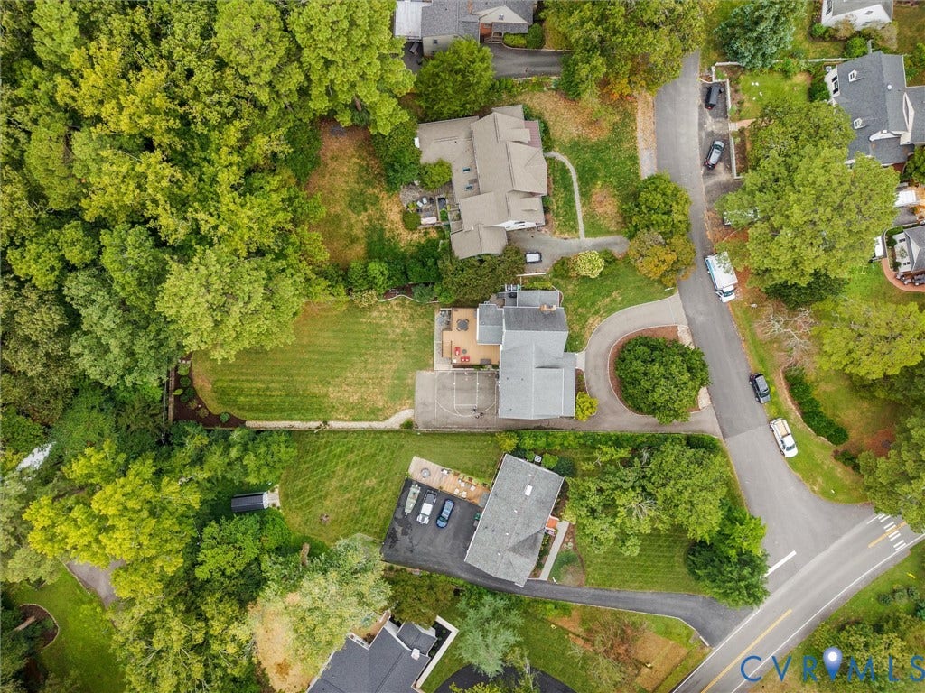 600 Baldwin Road, Henrico, VA 23229 Aerial perspective of the property and surrounding residential area, featuring mature trees, landscaped grounds, and paved roadways