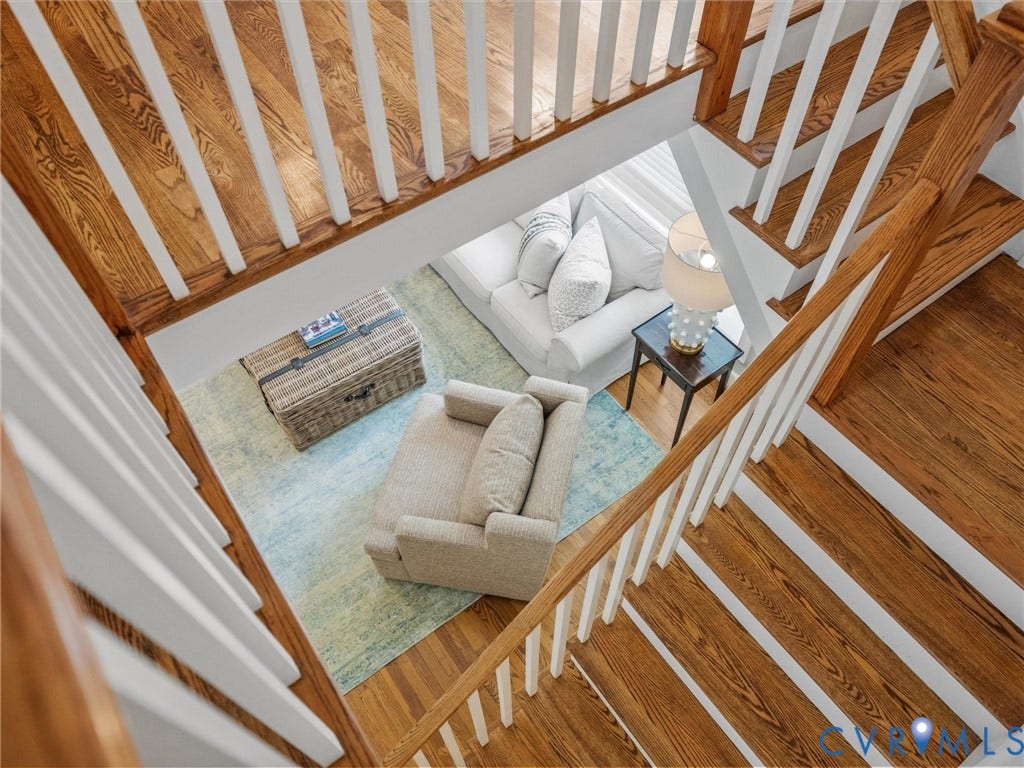 600 Baldwin Road, Henrico, VA 23229 Hardwood staircase with white balusters and wooden handrails