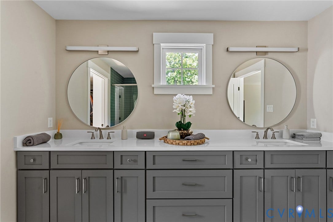 13003 Farrington Place Lane, Farrington Place, Hanover, VA 23059 Double vanity with gray shaker cabinetry, integrated rectangular sinks, and surface-mounted circular mirrors