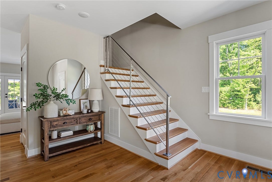 13003 Farrington Place Lane, Farrington Place, Hanover, VA 23059 Hardwood flooring extending to staircase treads, modern cable railing system, white window trim, and recessed lighting
