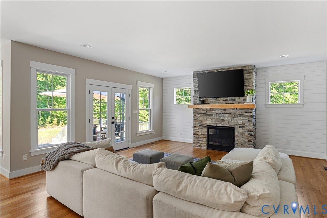 13003 Farrington Place Lane, Farrington Place, Hanover, VA 23059 Living area featuring wood-finish flooring, a stone-clad fireplace with a wood mantle, and bright recessed lighting