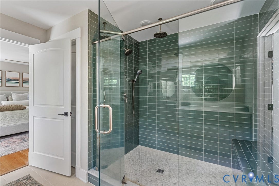 13003 Farrington Place Lane, Farrington Place, Hanover, VA 23059 Glass-enclosed shower with horizontal tile walls, a built-in bench, and a rainfall showerhead