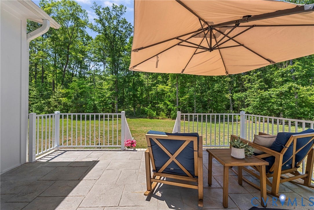 13003 Farrington Place Lane, Farrington Place, Hanover, VA 23059 Patio featuring paver flooring, white railing, and a background of mature trees