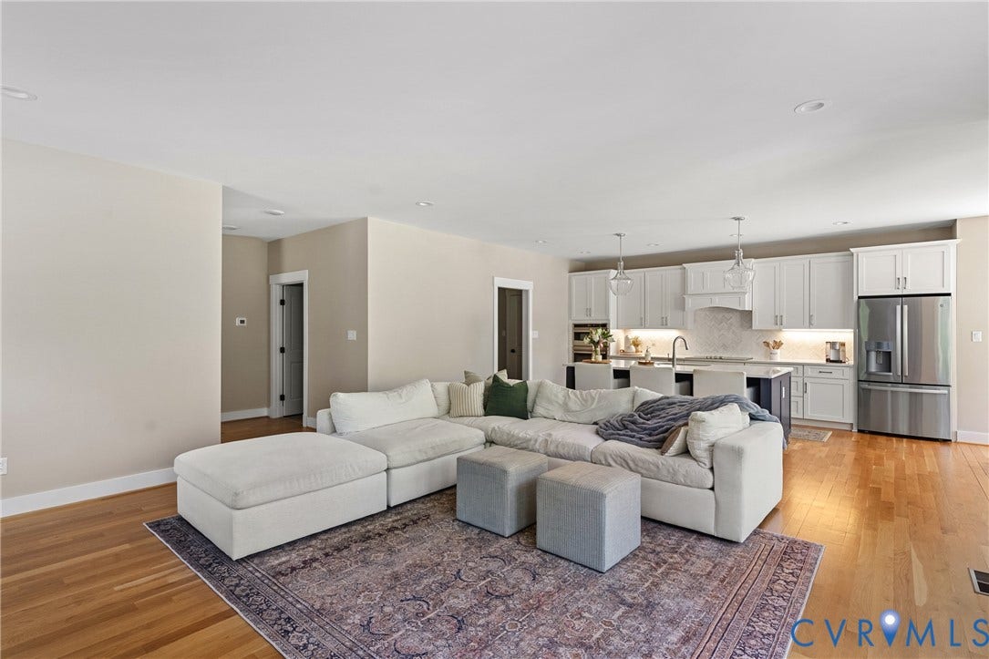 13003 Farrington Place Lane, Farrington Place, Hanover, VA 23059 Hardwood flooring throughout, recessed lighting, and a kitchen featuring white cabinetry, stainless steel appliances, and a central island with pendant lighting