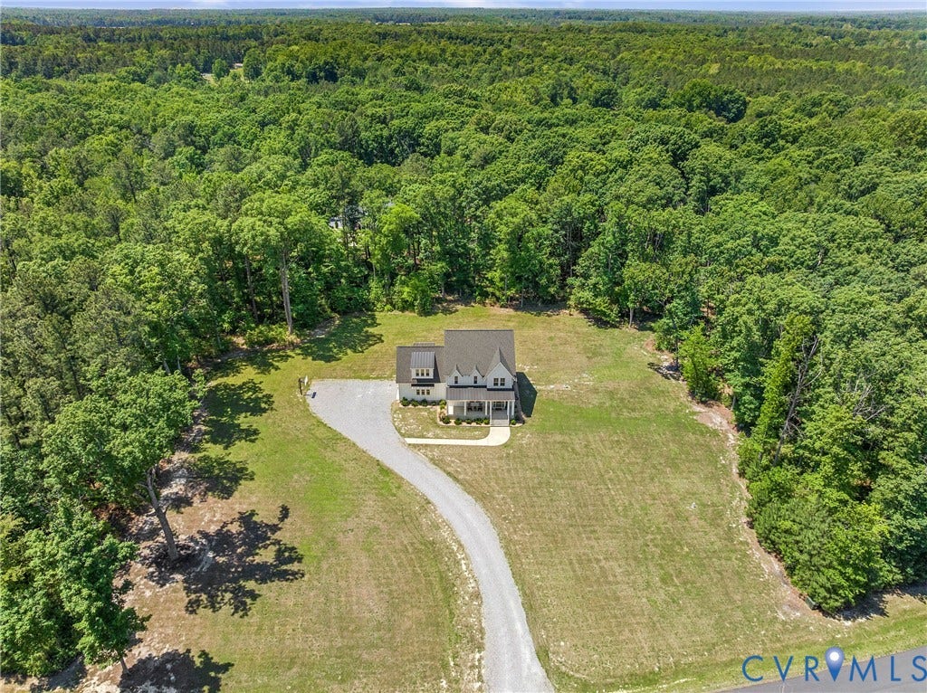 13003 Farrington Place Lane, Farrington Place, Hanover, VA 23059 Expansive lot with a gravel driveway, surrounded by mature trees