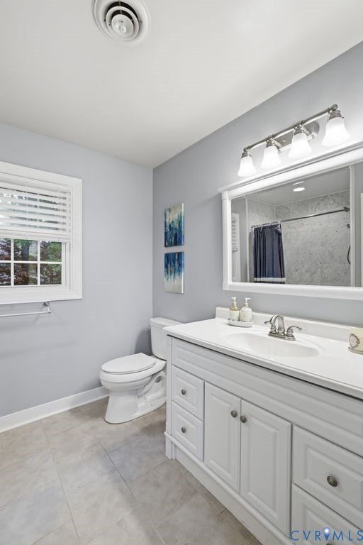 9612 Kingscroft Drive, Glen Allen, VA 23060 Bathroom featuring a white vanity with integrated sink, chrome faucet, and a large framed mirror