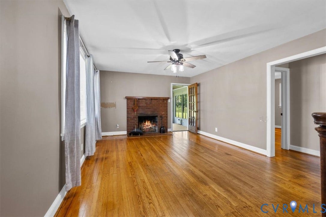 3577 Old Buckingham Road, Powhatan, VA 23139 Hardwood flooring, brick fireplace, ceiling fan with integrated lighting, and French doors leading to a screened area