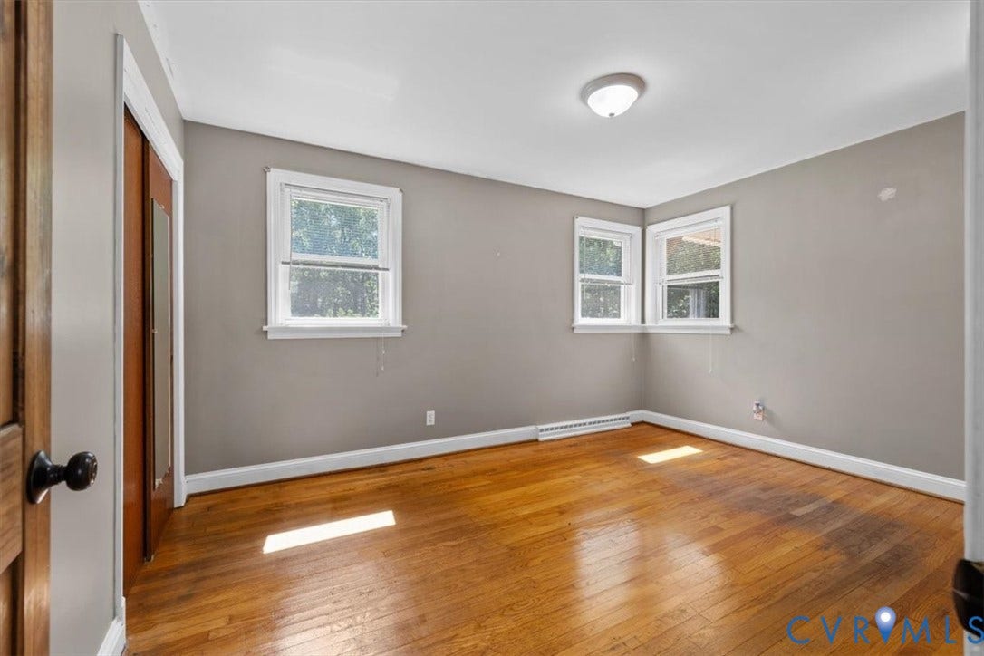 3577 Old Buckingham Road, Powhatan, VA 23139 Wood-finish flooring, multiple windows, ceiling-mounted light fixture, and neutral wall tones