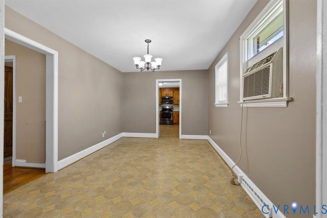 3577 Old Buckingham Road, Powhatan, VA 23139 Neutral paint colors, white trim accents, and a ceiling-mounted chandelier