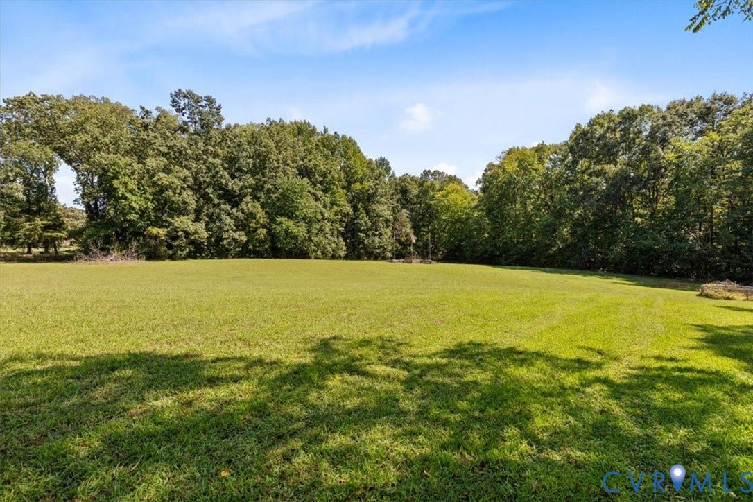 3577 Old Buckingham Road, Powhatan, VA 23139 Expansive green lawn with a perimeter of mature deciduous trees