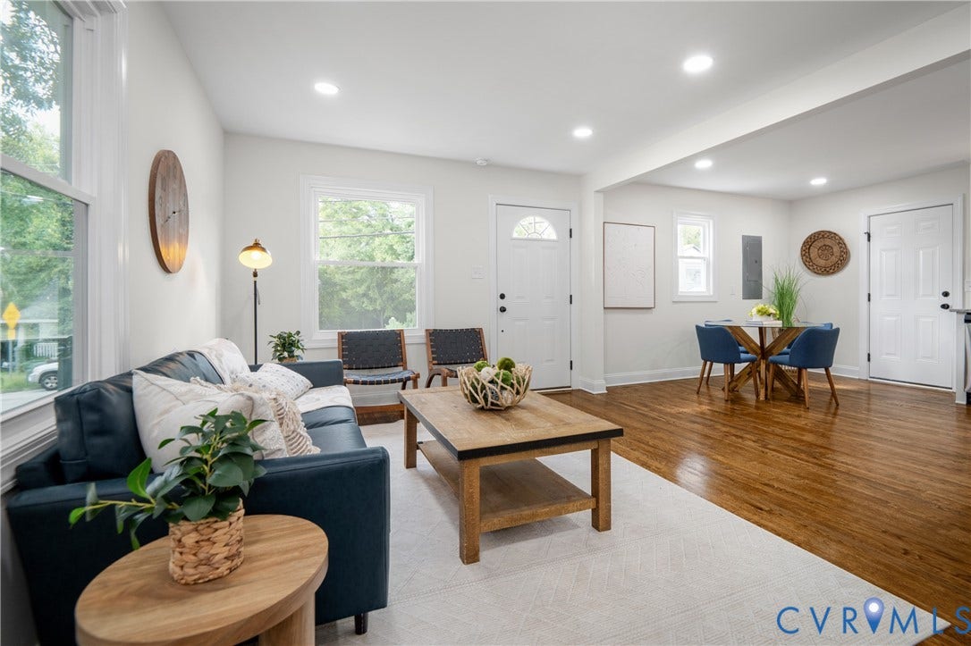 2211 Royall Avenue, Bellemeade, Richmond, VA 23224 Recessed lighting illuminates the open living and dining areas featuring wood flooring, white walls, and multiple windows