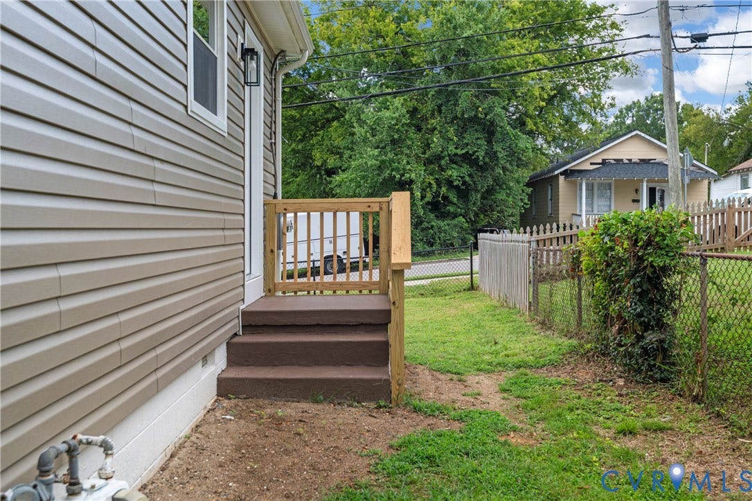 2211 Royall Avenue, Bellemeade, Richmond, VA 23224 Siding exterior with a fenced yard and exterior lighting fixture