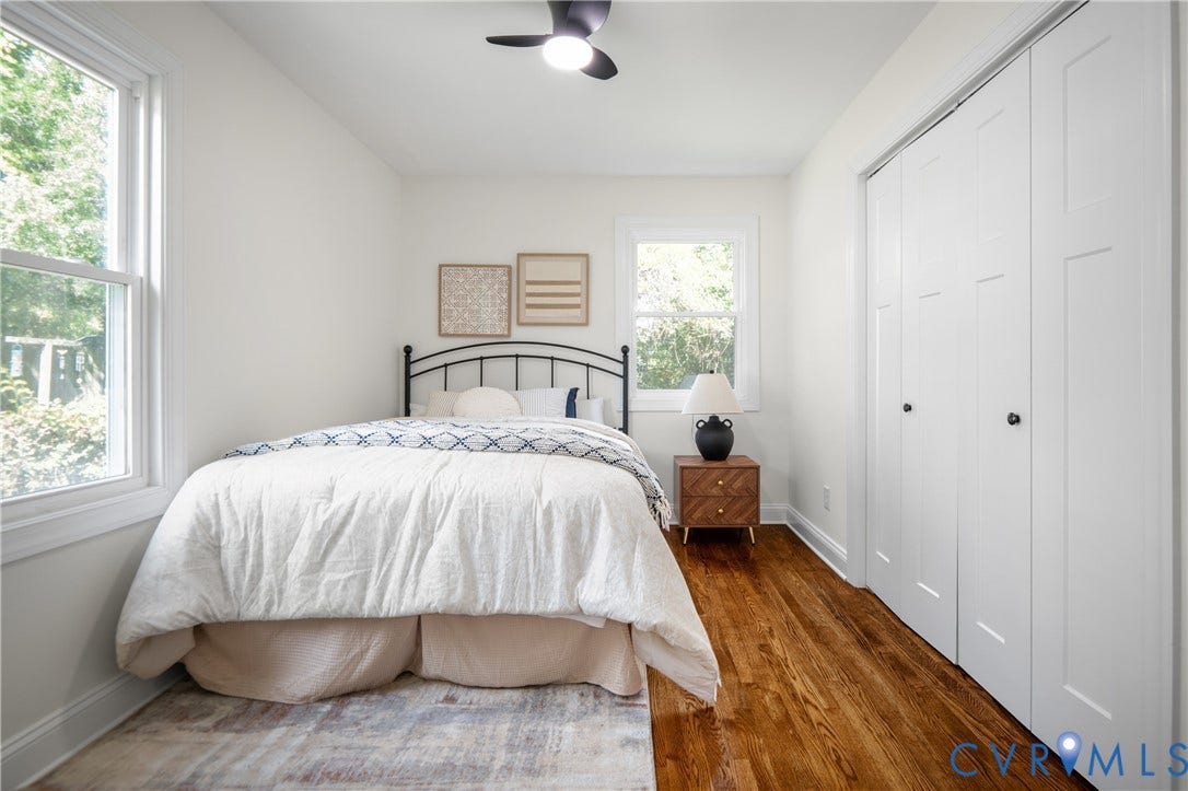 2211 Royall Avenue, Bellemeade, Richmond, VA 23224 Hardwood flooring throughout, bright white walls, two double-hung windows, and a ceiling fan