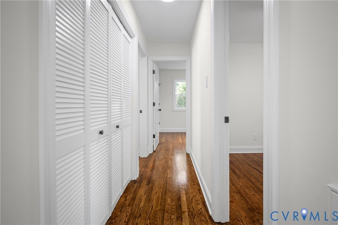 2211 Royall Avenue, Bellemeade, Richmond, VA 23224 Hardwood flooring throughout, white louvered bifold closet doors, white interior walls, and multiple doorways