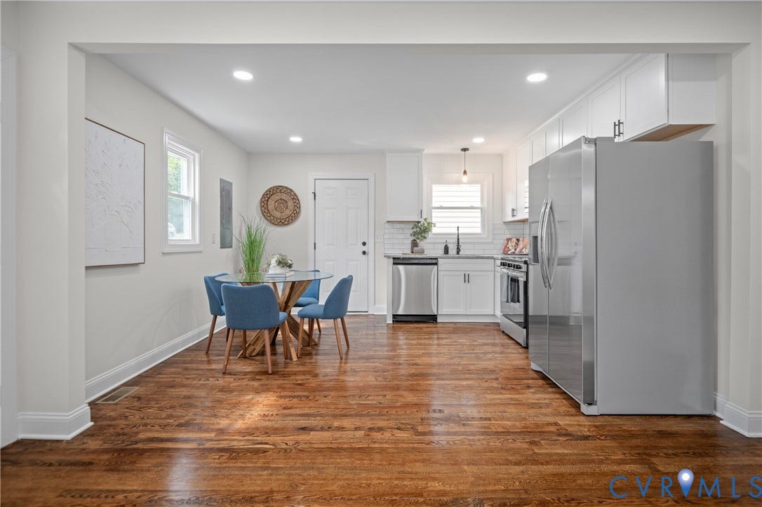 2211 Royall Avenue, Bellemeade, Richmond, VA 23224 Hardwood flooring, recessed lighting, white kitchen cabinetry, stainless steel appliances, and a tile backsplash