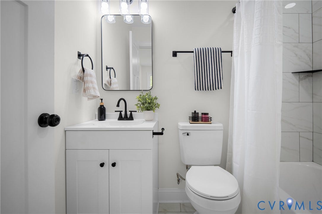 2211 Royall Avenue, Bellemeade, Richmond, VA 23224 White vanity with shaker-style cabinetry, matte black faucet, and a rectangular mirror