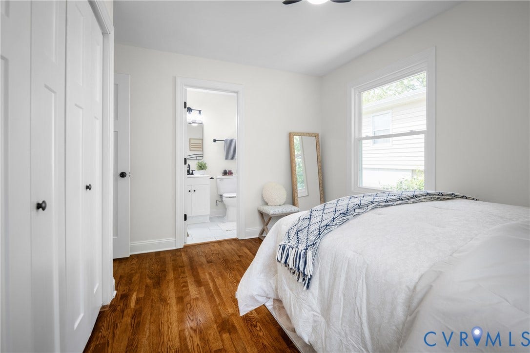 2211 Royall Avenue, Bellemeade, Richmond, VA 23224 Hardwood flooring, white paneled doors, white trim, a double-hung window, and a ceiling fan