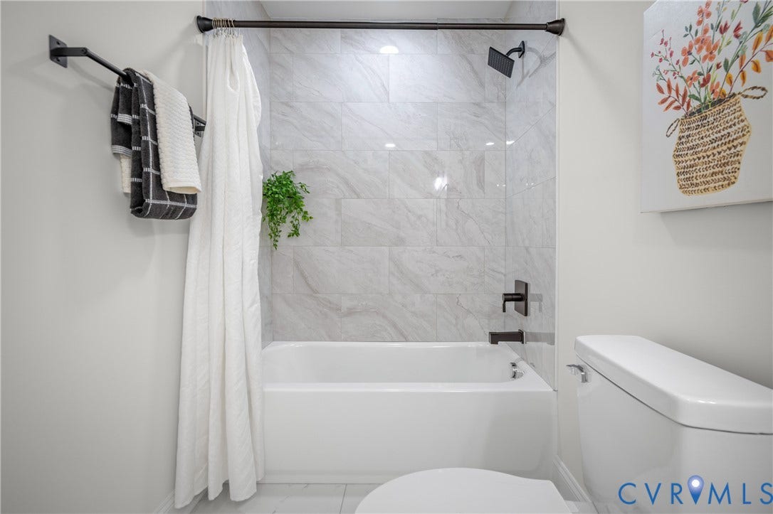 2211 Royall Avenue, Bellemeade, Richmond, VA 23224 Tub/shower combination with matte black fixtures and light gray marble-look tile surround