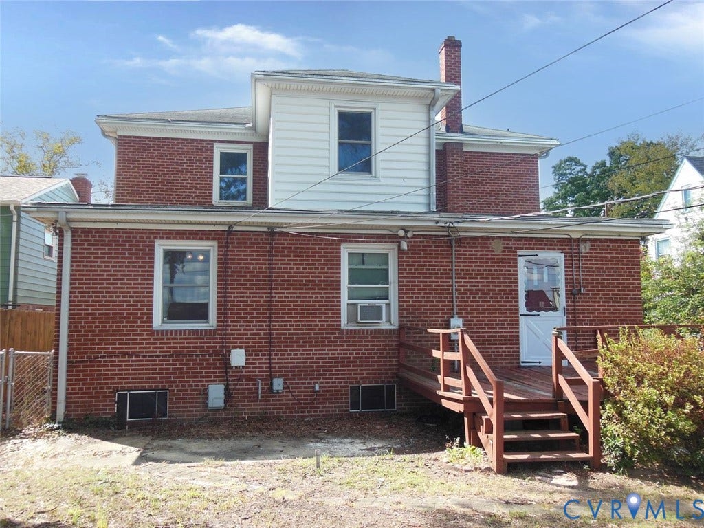 2203 Seminary Avenue, Richmond, VA 23220 Brick exterior with white siding accents and a rear wooden deck