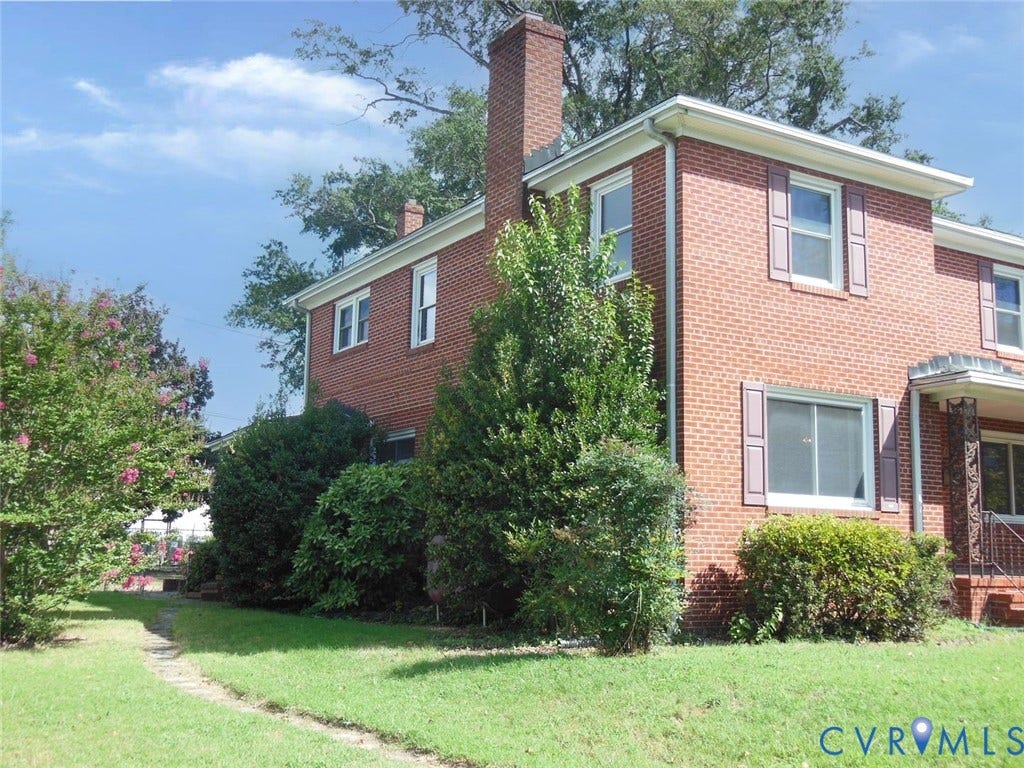 2203 Seminary Avenue, Richmond, VA 23220 Brick exterior featuring multiple windows with shutters