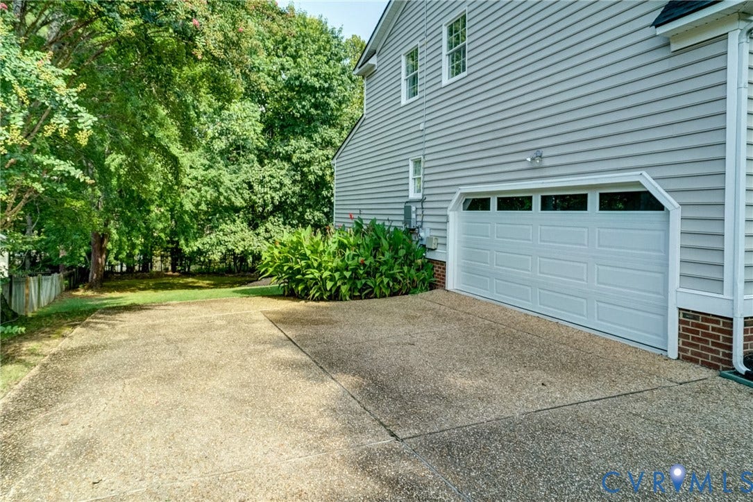 Attached 2-car garage with over-sized parking apron