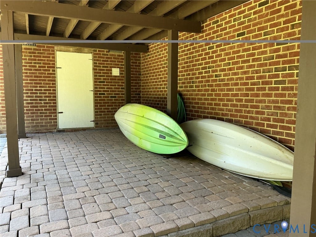 The kayaks are drying outside the storage room.