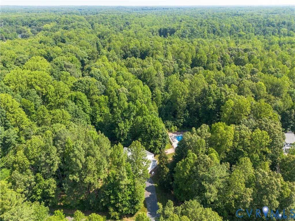 Aerial perspective with extensive tree canopy