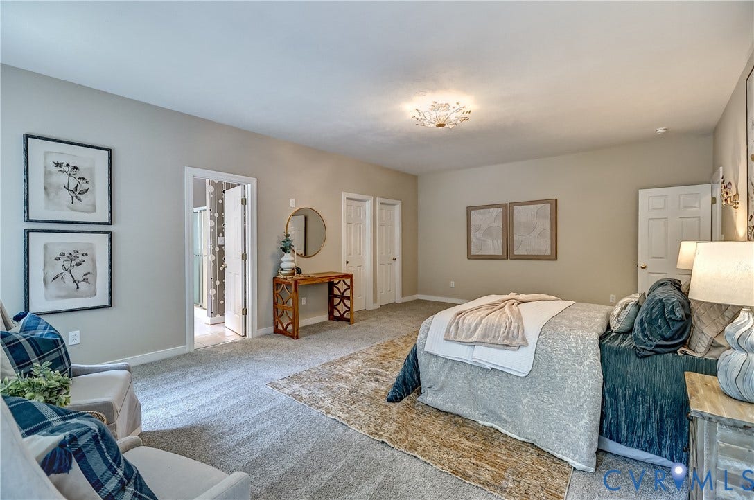 Carpeted flooring throughout, recessed lighting fixture, solid doors, and a bathroom with a shower enclosure