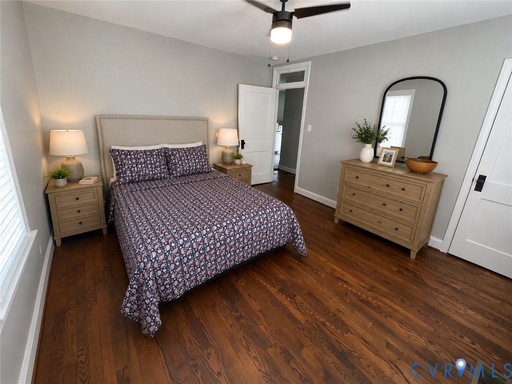 Hardwood flooring, light gray wall paint, white trim, ceiling fan, and white paneled doors