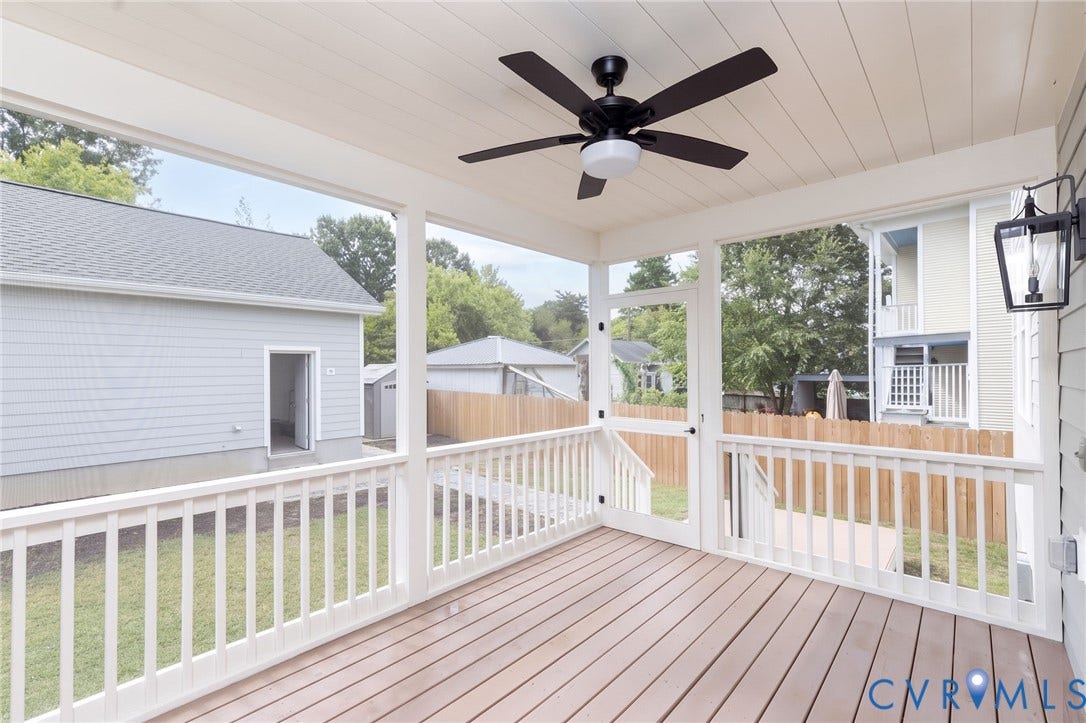 404 W 31st Street, Woodland Heights, Richmond, VA 23225 Screened porch with wood-finish decking, white railings, and a ceiling fan