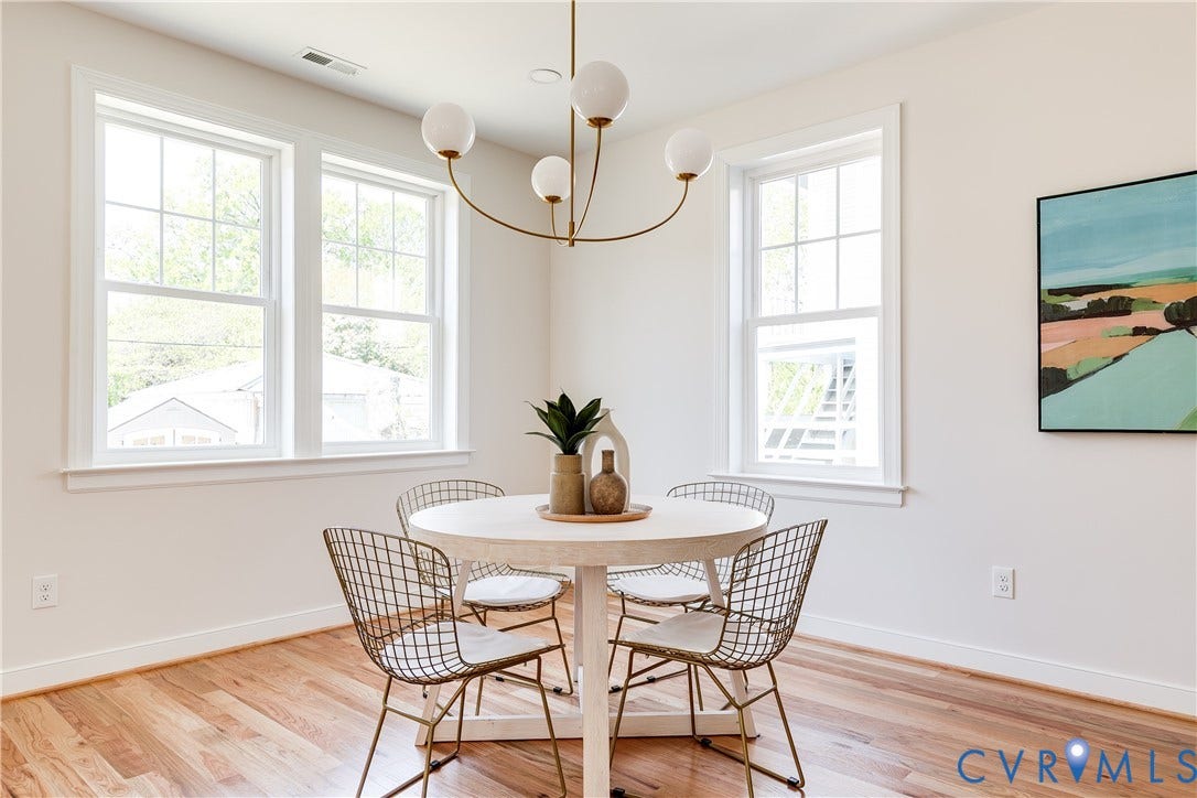 404 W 31st Street, Woodland Heights, Richmond, VA 23225 Wood-finish flooring, white walls, and a multi-pane window configuration create a bright interior