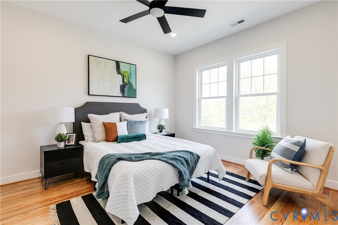 404 W 31st Street, Woodland Heights, Richmond, VA 23225 Recessed lighting and ceiling fan complement the bright space, featuring multiple windows, and wood-finish flooring