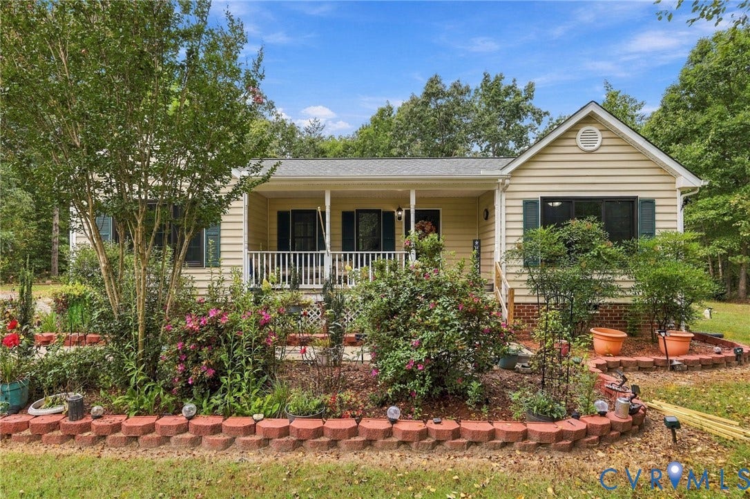133 Ford Road, Bumpass, VA 23024 Single-story residence featuring light yellow siding and a covered front porch