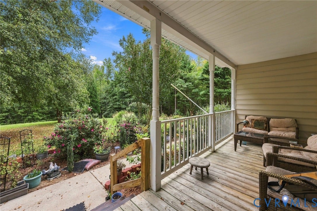 133 Ford Road, Bumpass, VA 23024 Expansive covered porch with wood-finish decking and white railing