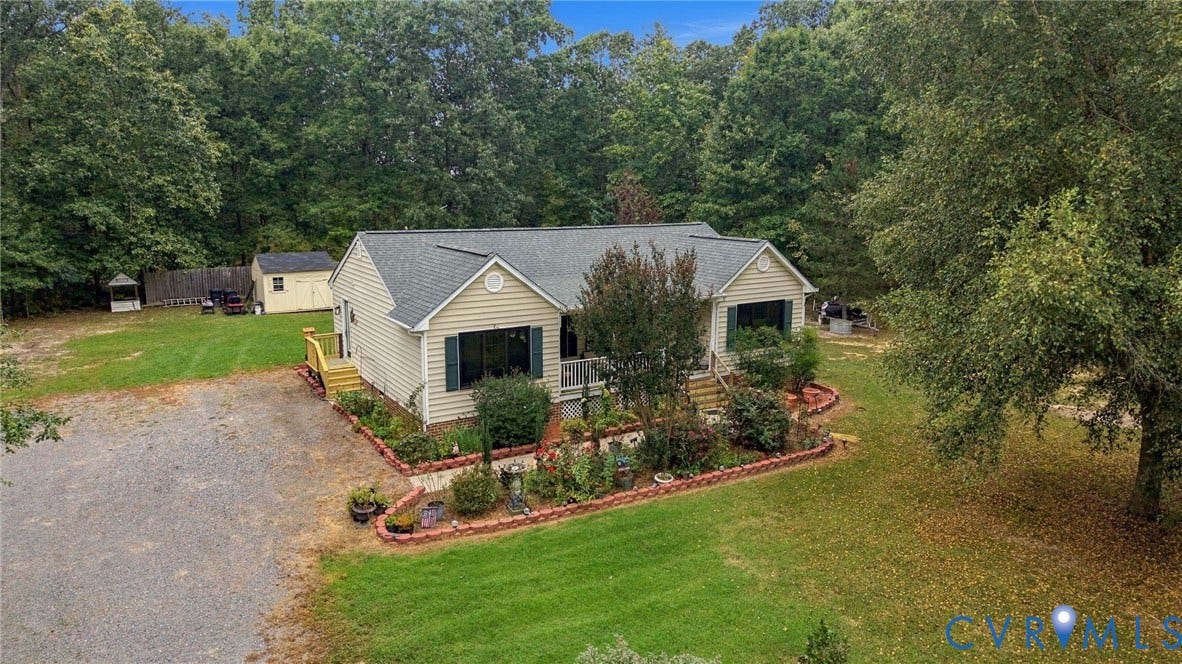 133 Ford Road, Bumpass, VA 23024 Ranch-style residence featuring light-colored siding, a dark-shingled roof, and dark shutters