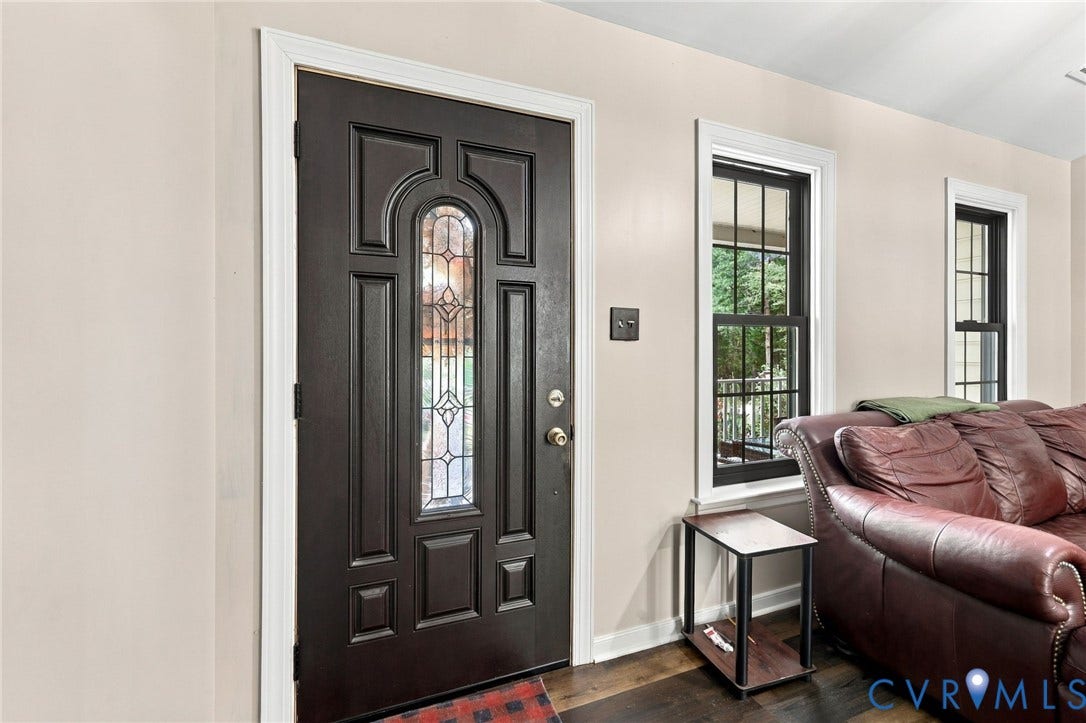 133 Ford Road, Bumpass, VA 23024 Dark wood-finish entry door with decorative glass insert