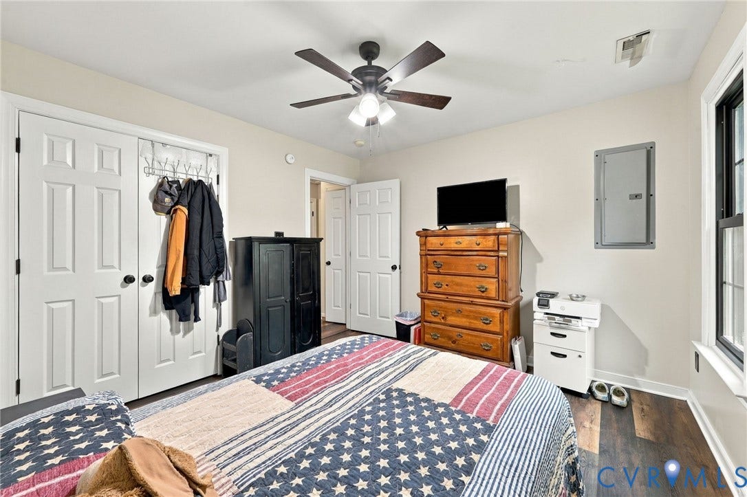 133 Ford Road, Bumpass, VA 23024 Recessed ceiling fan, wood-finish flooring, white panel doors, and a window with dark trim