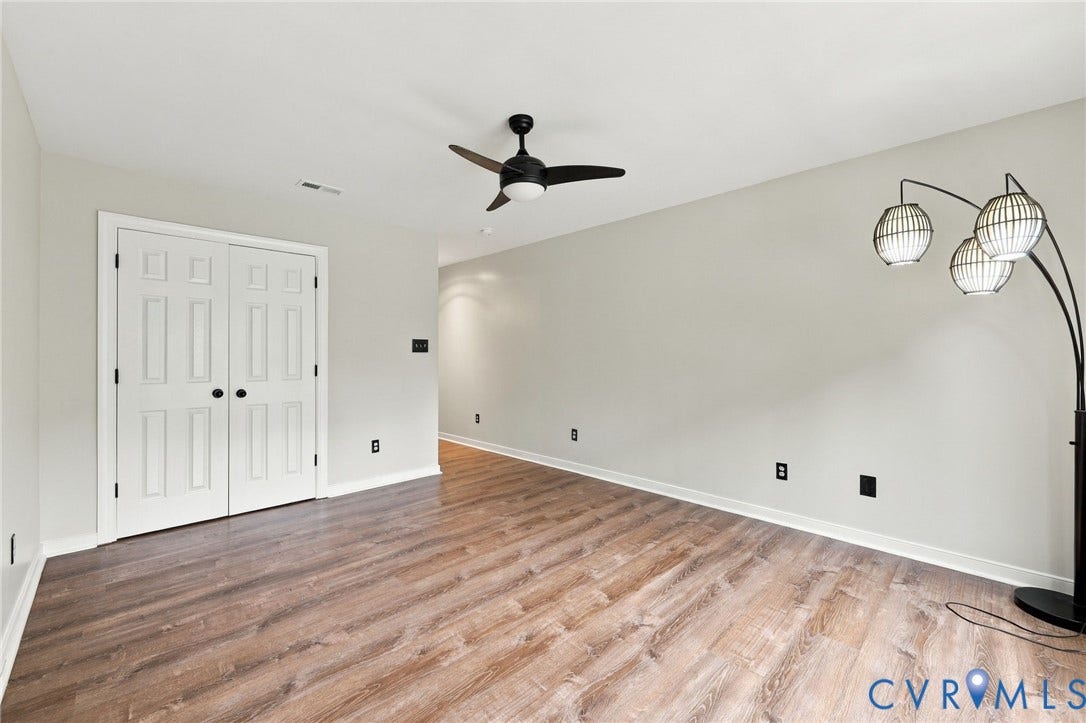 133 Ford Road, Bumpass, VA 23024 Wood-finish flooring, light gray walls, and white trim