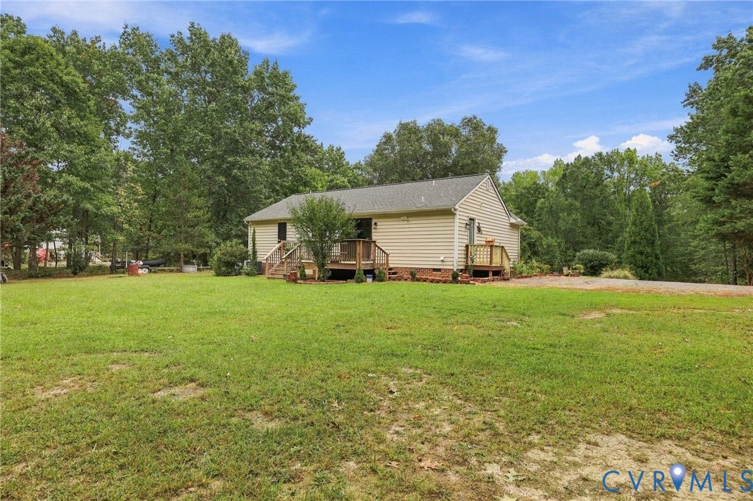 133 Ford Road, Bumpass, VA 23024 Exterior featuring horizontal vinyl siding, a gabled roof, and a wood deck