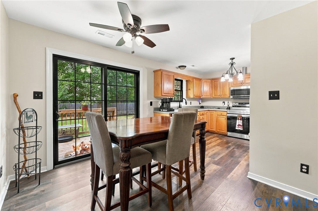 133 Ford Road, Bumpass, VA 23024 Wood-finish flooring, recessed lighting, ceiling fan, sliding glass door, and wooden cabinetry