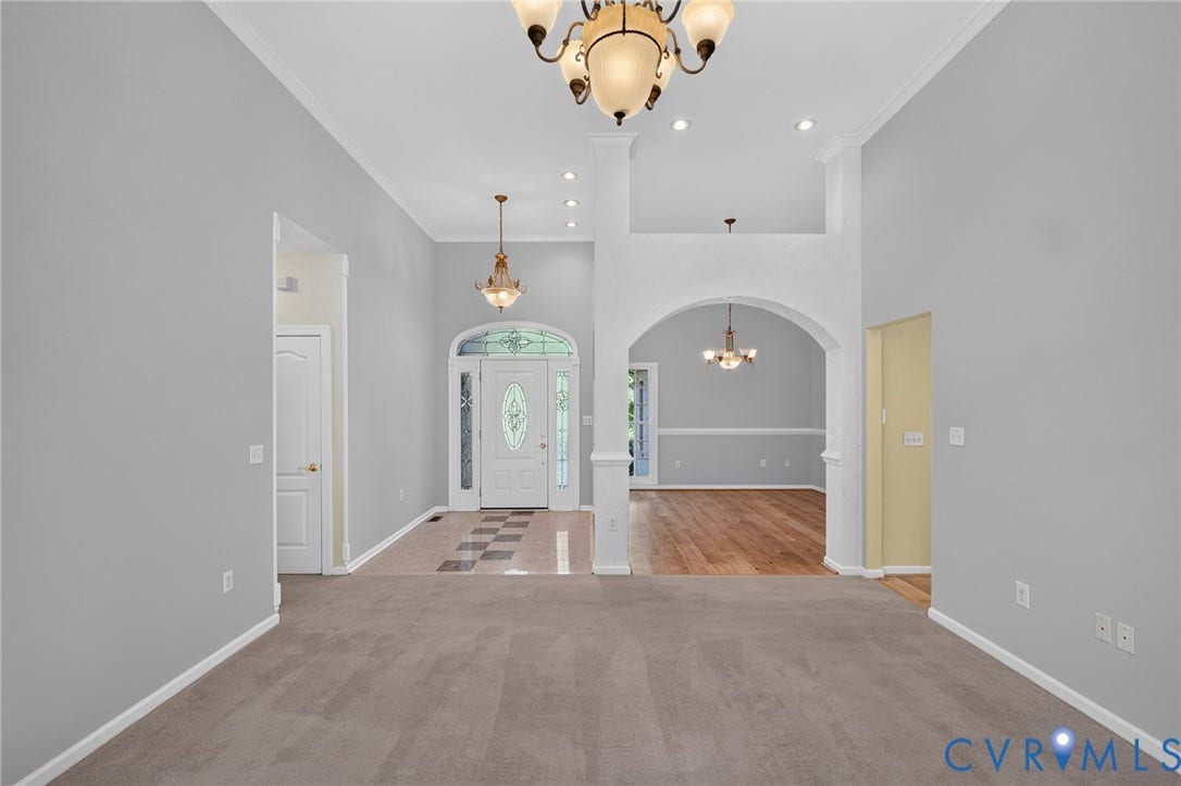 365 Hamlet Road, Manakin Sabot, VA 23103 Vaulted ceiling with crown molding, chandelier lighting, recessed lighting, arched entryway, and wood-finish flooring