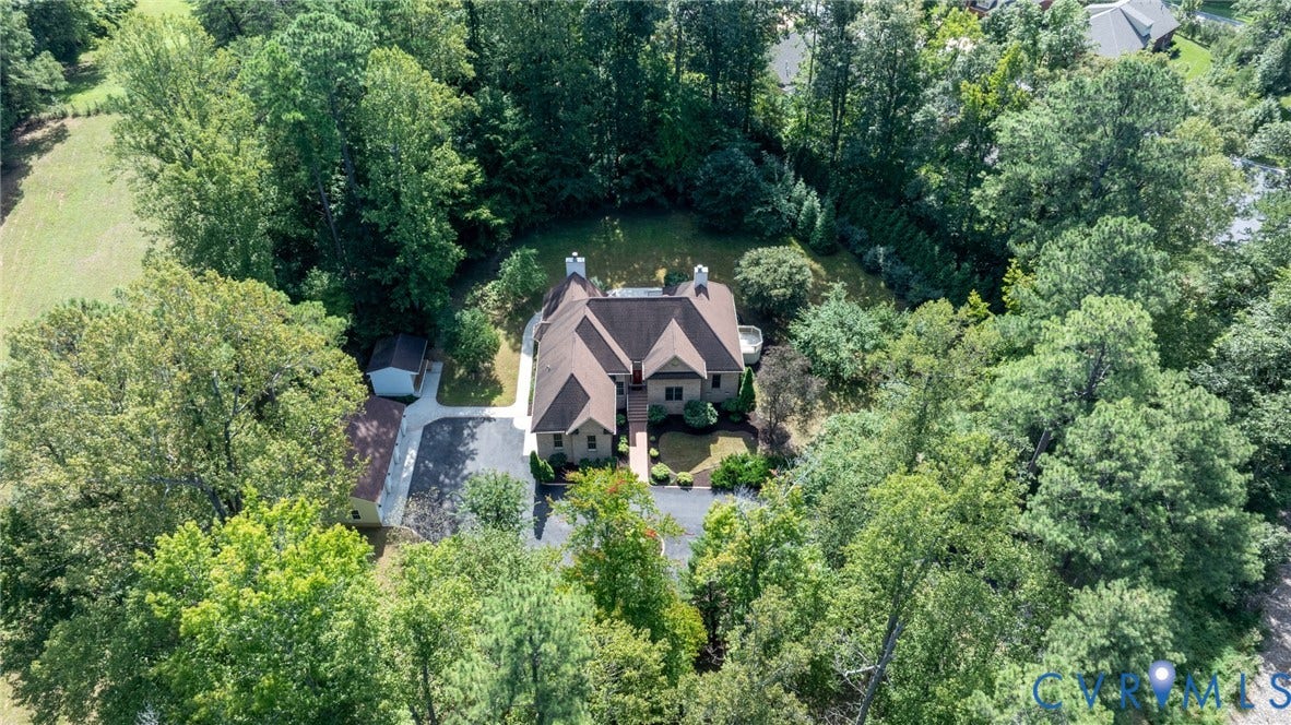 365 Hamlet Road, Manakin Sabot, VA 23103 Wooded property with a multi-gabled main residence, attached garage, and separate outbuilding