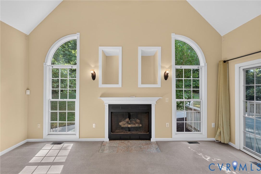 365 Hamlet Road, Manakin Sabot, VA 23103 Vaulted ceiling with twin arched windows, fireplace with classic mantel, recessed wall niches, and sliding glass door access
