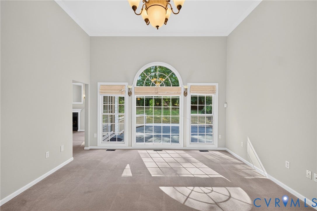 365 Hamlet Road, Manakin Sabot, VA 23103 Vaulted ceiling, arched transom window, large picture windows, recessed lighting, and a chandelier