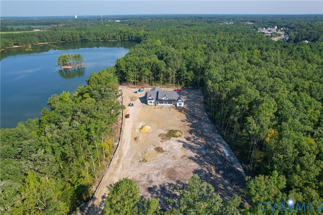 13216 Bradley Bridge Road, Chester, VA 23831 Single-story residence featuring a dark roof and light siding